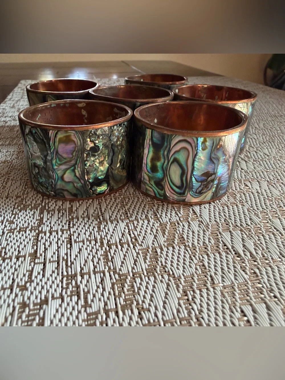 Copper and abalone shell napkin rings